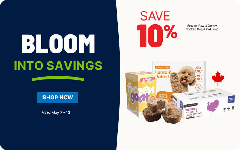 Promotional banner split into two sections. On the left, a dark blue background features large white text reading &ldquo;BLOOM&rdquo; with bright green text below saying &ldquo;INTO SAVINGS,&rdquo; underlined in green. A blue button labeled &ldquo;SHOP NOW&rdquo; appears beneath, with smaller white text indicating &ldquo;Valid May 7 &ndash; 13.&rdquo; On the right, a light background displays red text &ldquo;SAVE 10%&rdquo; above smaller text reading &ldquo;Frozen, Raw & Gently Cooked Dog & Cat Food.&rdquo; Below, there are images of packaged pet food products, including boxes labeled &ldquo;lamb & rabbit,&rdquo; &ldquo;backyard,&rdquo; and &ldquo;turkey,&rdquo; alongside a small dog and some food portions. A red maple leaf icon appears to the right.