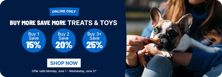 Ad showing a dog being fed a treat on the right and text on the left reading &ldquo;Online only: Buy more save more treats & toys &mdash; buy 1 save 15%, buy 2 save 20%, buy 3+ save 25%,&rdquo; with a &ldquo;Shop Now&rdquo; button and offer dates June 1&ndash;3.