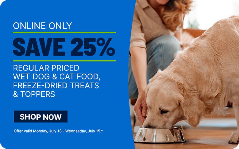Golden retriever eating from a metal bowl beside a promotional banner advertising 25% off regular-priced wet dog and cat food, freeze-dried treats, and toppers online only.